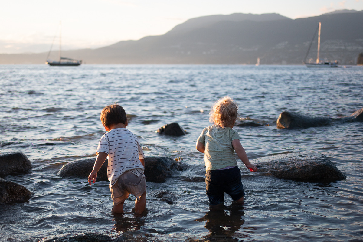 Kids wading in the water near Vancouver
